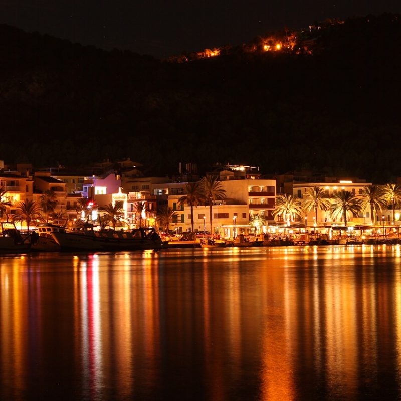 Image of Palma de Mallorca at night, illuminated, as seen from the sea