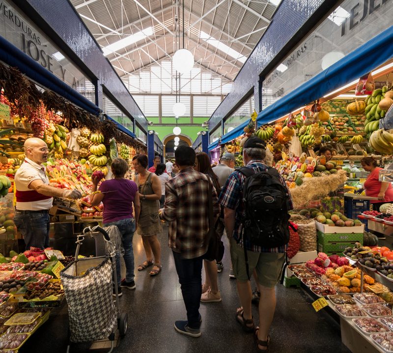 View of the bustling central market of La Vegueta in Las Palmas de Gran Canaria, with colorful stalls and vibrant local produce