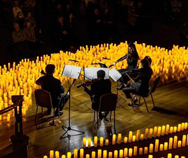 Candlelight concert in Sevilla, featuring musicians performing in a beautifully lit atmosphere