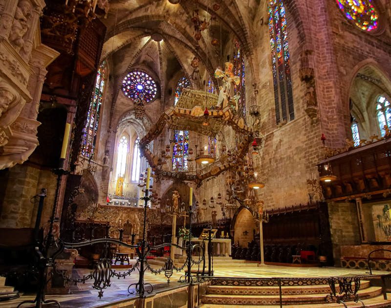 Interior view of the Cathedral of Palma de Mallorca, showcasing its stunning architecture and stained glass windows