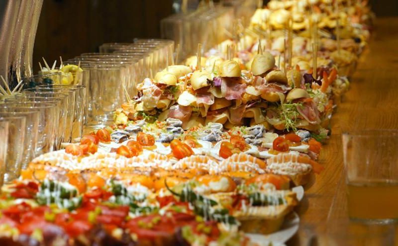 A bar counter full of traditional pintxos in San Sebastián