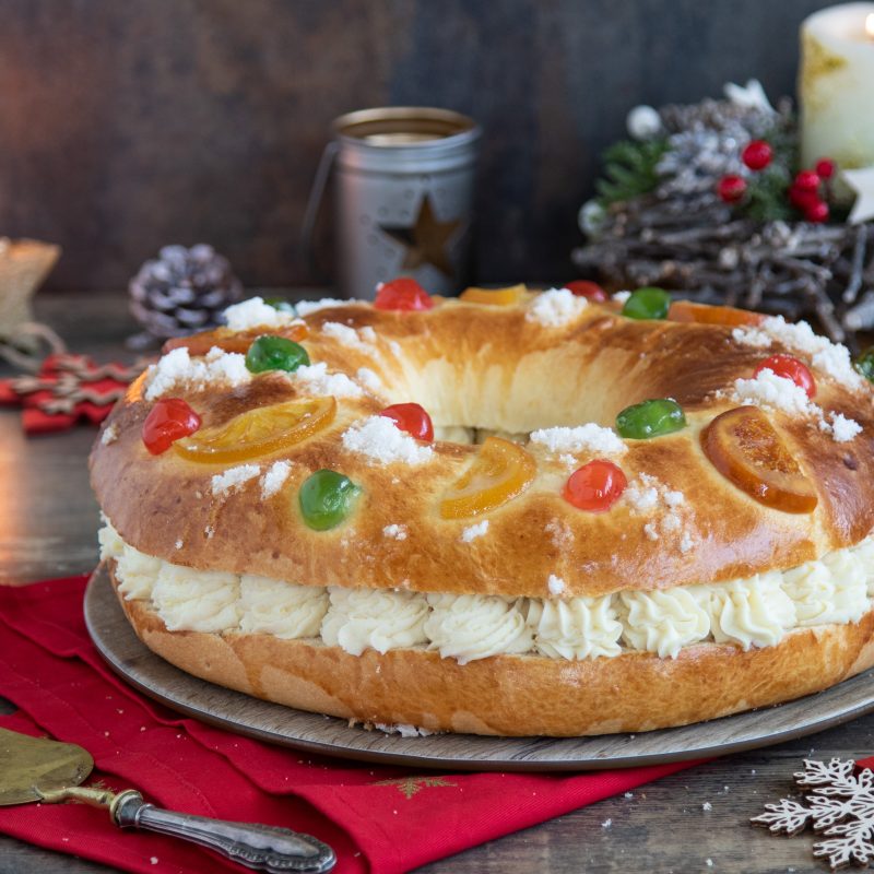 A traditional Roscón de Reyes filled with whipped cream, a popular treat during the Three Kings celebrations