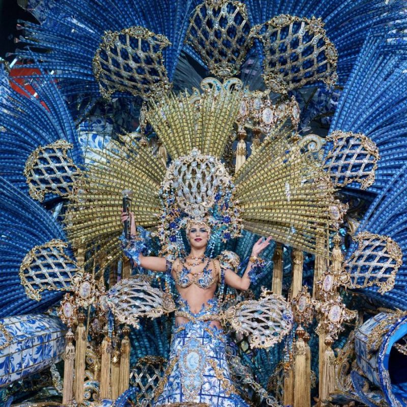 A carnival queen candidate in the Las Palmas Carnival wearing an elaborate and colorful costume