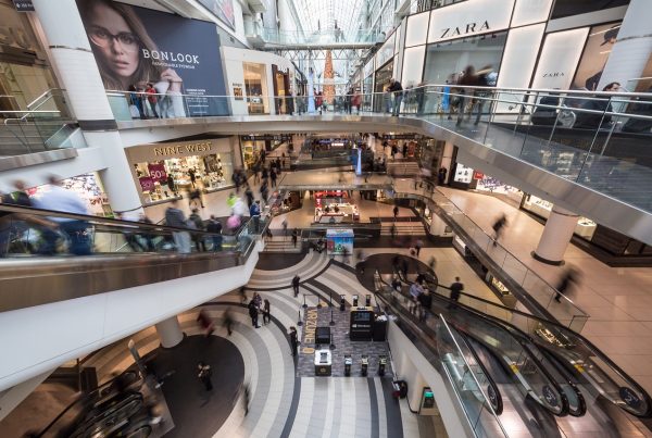 Interior of a shopping mall in Madrid with various stores and shoppers
