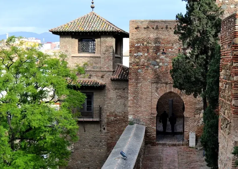 Section of the outer wall with an arched entrance gate at the Alcazaba of Málaga