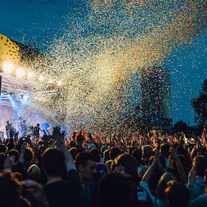Crowd enjoying an outdoor concert in Paris at dusk during the Music festival in Paris